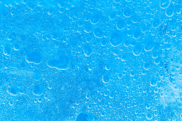 istock air bubbles frozen inside block of blue ice 494673243