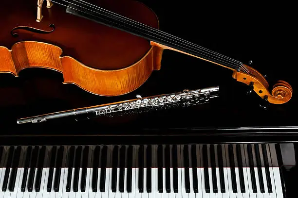 Photo of Musical instruments lying on the piano