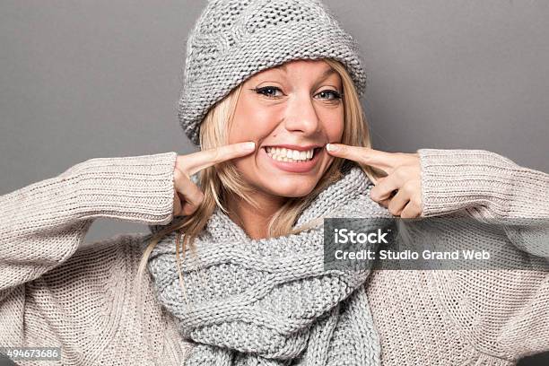 Ecstatic Sexy 20s Winter Girl Expressing Joy With Fake Smile Stock Photo - Download Image Now