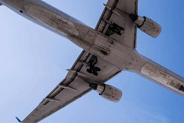 istock Airplane flying in the blue sky 494673983