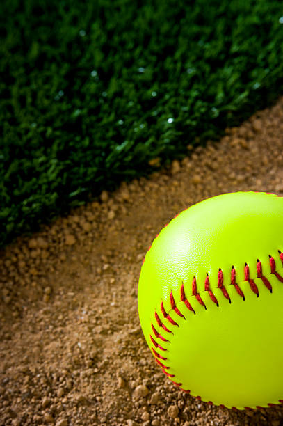 softball close-up - softball playing field fluorescent team sport - fotografias e filmes do acervo