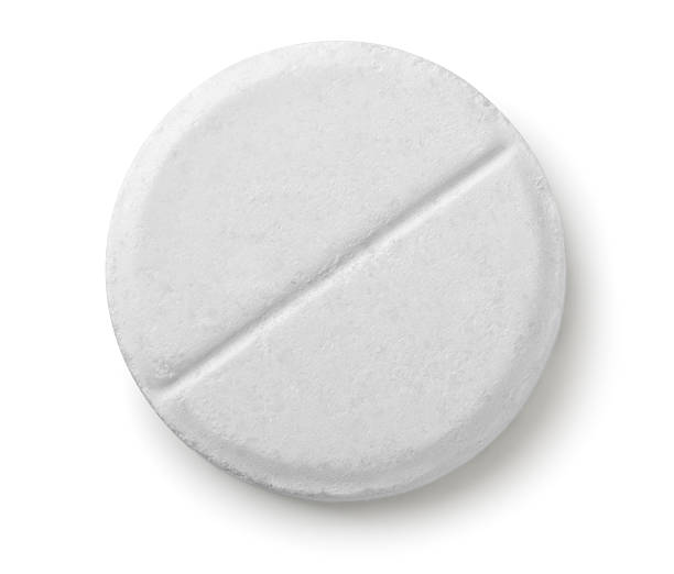 Pill Single white pill isolated on white aspirin photos stock pictures, royalty-free photos & images