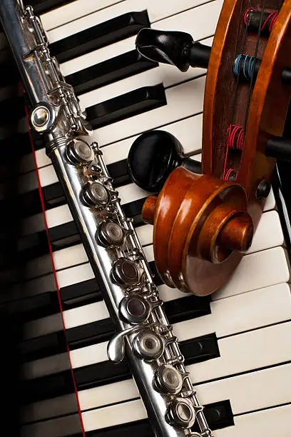 Photo of Musical instruments lying on the piano