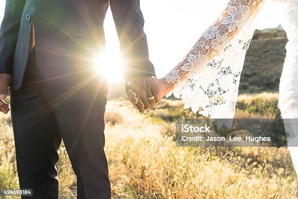 Interracial Couple Holding Hands At Wedding Stock Photo - Download Image Now - Wedding, Couple - Relationship, Married