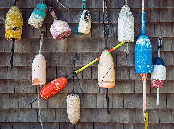 istock Old lobster buoys on the wall 494698480