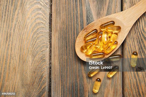 Fish Oil Capsules In A Spoon Stock Photo - Download Image Now - Cod Liver Oil, Letter D, Number 3