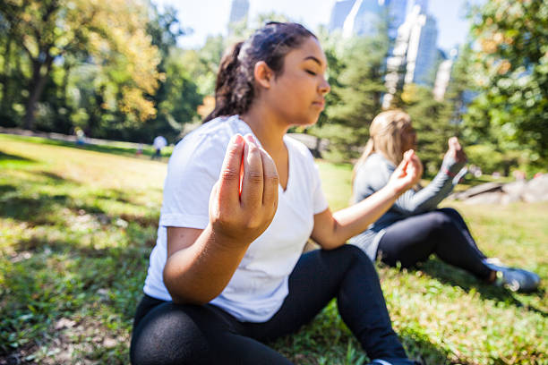 istock Women doing Yoga exercises in Central Park New York 494702076