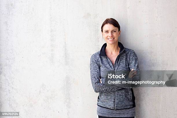 Attractive Older Sports Woman Smiling Stock Photo - Download Image Now - Women, Sports Clothing, One Woman Only