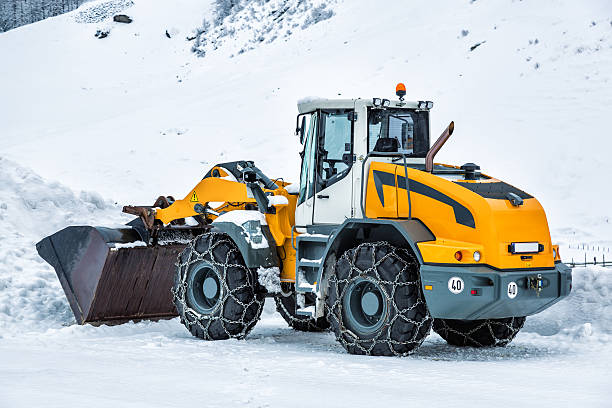 istock Earth mover used as snowplough for removing snow on road 494703220
