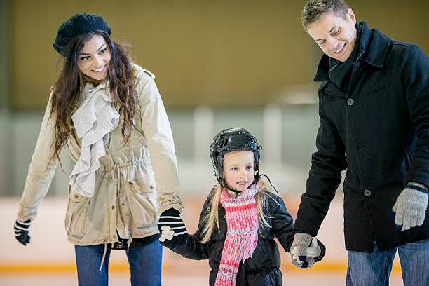 istock Family at an Indoor Skating Rink 494703926