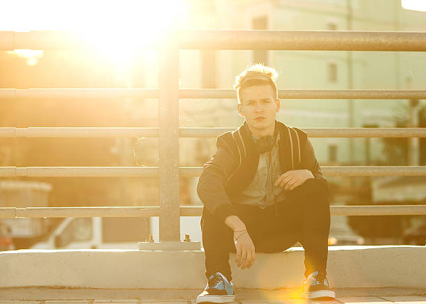 istock guy hipster listens to th e player on the street 494704466