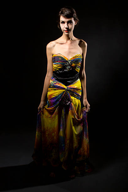 istock Bright Yellow Dress on a Dark Background 494704514