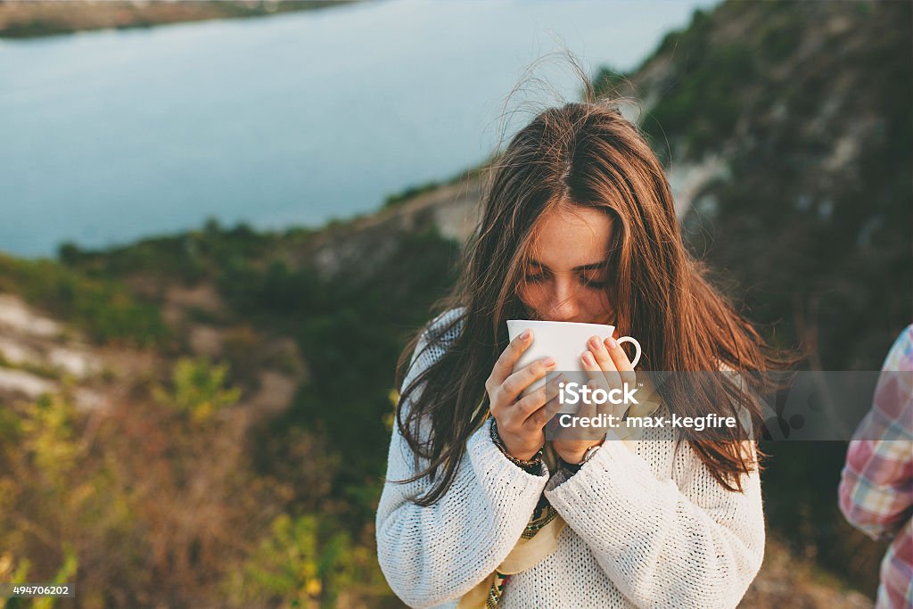 Teenage girl drinking coffee. Teenage girl drinking coffee. Beautiful young woman in casual wear with cup of hot coffee. Drinking Stock Photo