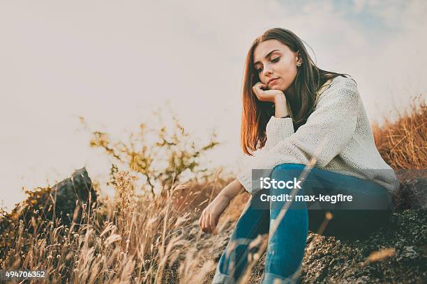 Sad Girl Thinking Outdoors Stock Photo - Download Image Now - Women, Autumn, Contemplation