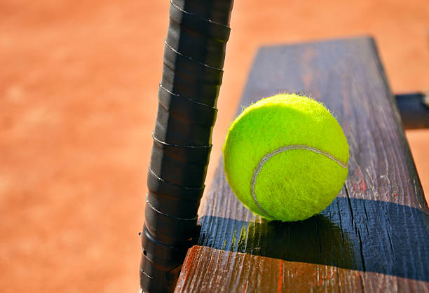 istock tennis racket and ball on the bench horizontal 494707189