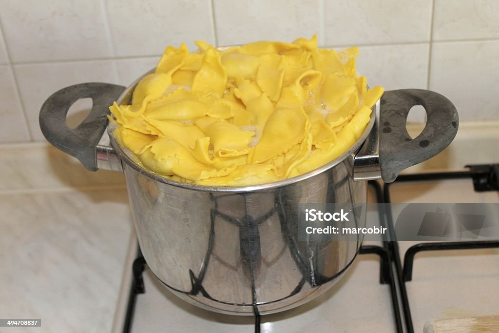 cooking typical type of italian pasta called casoncelli in pot Cooking Stock Photo