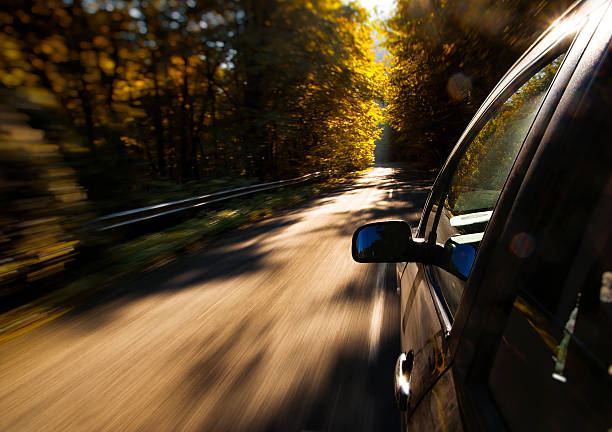 Car driving fast stock photo