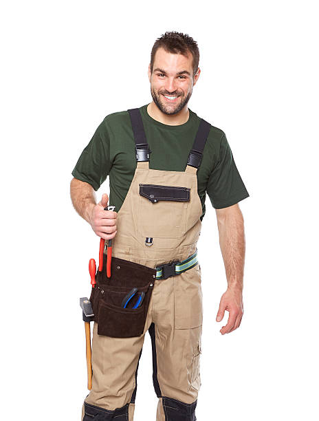 istock Portrait of smiling worker in brown uniform with tools 494709387