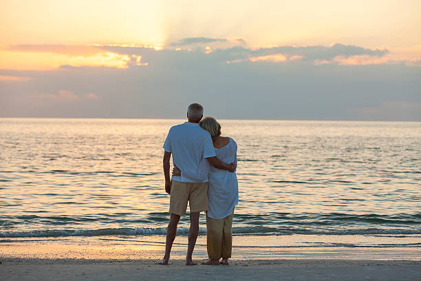 istock Senior Couple at Sunset Tropical Beach 494710446
