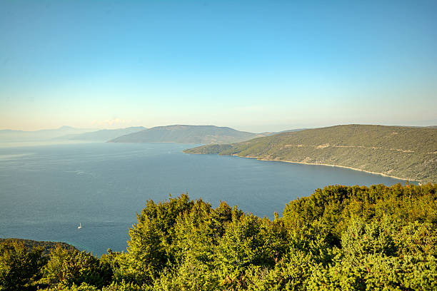Cres Island, Croatia: View to a lonely bay near village Valun in the evening sun