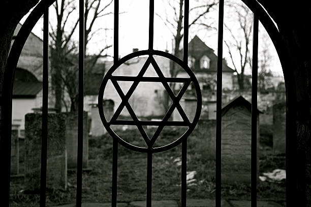 Judaism. Jewish Star of David. Jude Cemetery.Ghetto. Holocaust. Auschwitz. Judaism symbol. Jewish Star of David. Jude Cemetery in Cracow Ghetto. Kazimierz district. Poland. Auschwitz and Holocaust metaphor. Black and white. concentration camp photos stock pictures, royalty-free photos & images