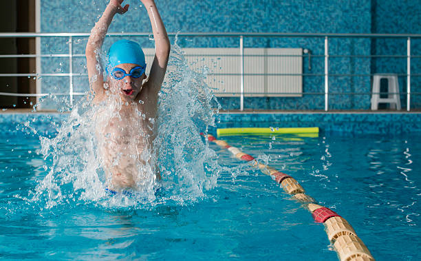 istock Child jump in swimming pool 494711419