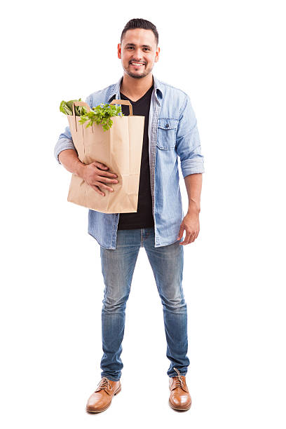 istock Attractive guy carrying groceries 494711822