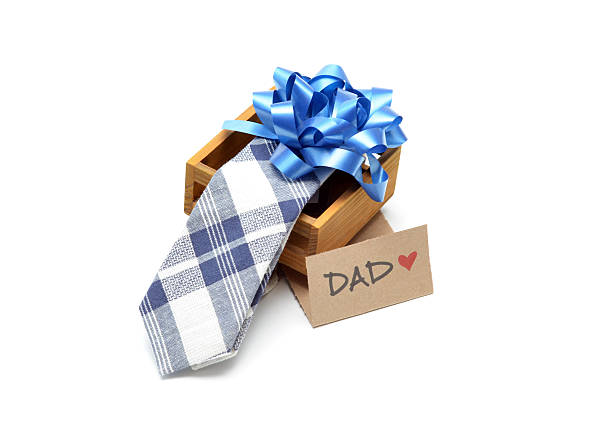 Close up of a tie in a box with a bow as a gift for Father's Day. 