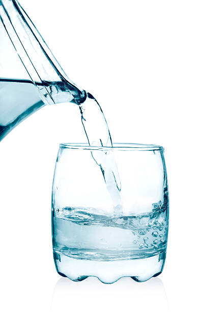 istock pouring water on a glass 494712742