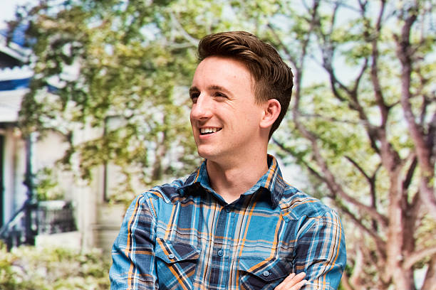 Cheerful man outdoors and looking away