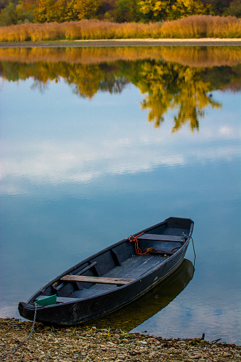 Boat On Calm Sea In Autumn