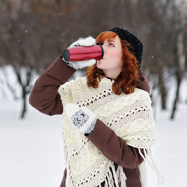 istock Young beautiful woman in winter park 494725880