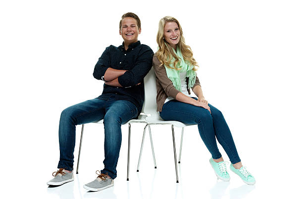 istock Smiling couple sitting on chair 494727252