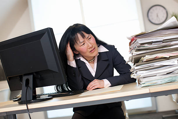 istock Asian Businesswoman Stressed Out at Work 494729906