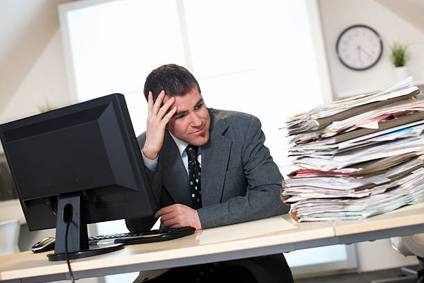 istock Business Man Overwhelmed with Paperwork 494730026