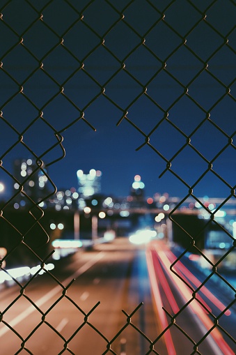 Long exposure chain link fence over a Portland highway 