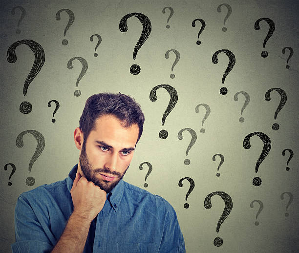 istock Worried sad man has many questions looking down 494730678