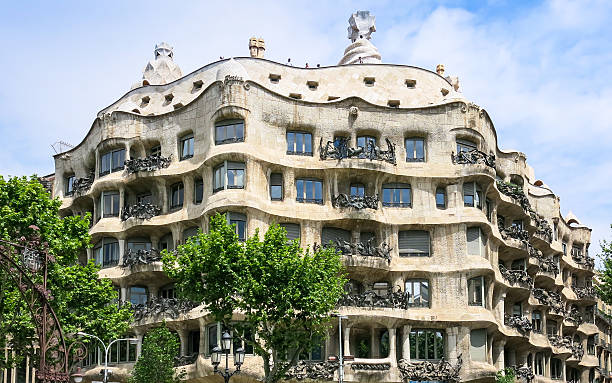 Casa Mila by Gaudi in Barcelona Barcelona, Spain - May 8, 2013: Casa Mila also known as La Pedrera, house by architect Gaudi casa stock pictures, royalty-free photos & images