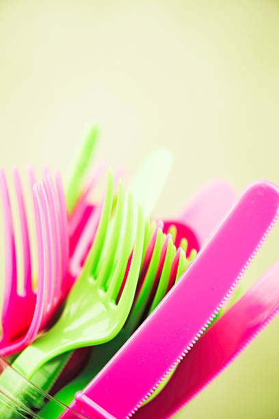 istock Colorful disposable plastic cutlery vintage toned 494733088