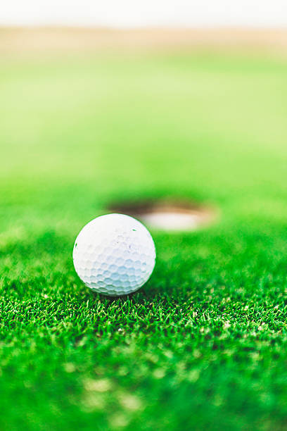 istock Golf Ball Next to Cup on Putting Green 494733152