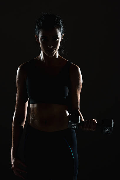 istock Sports female exercising with dumbbells 494733268