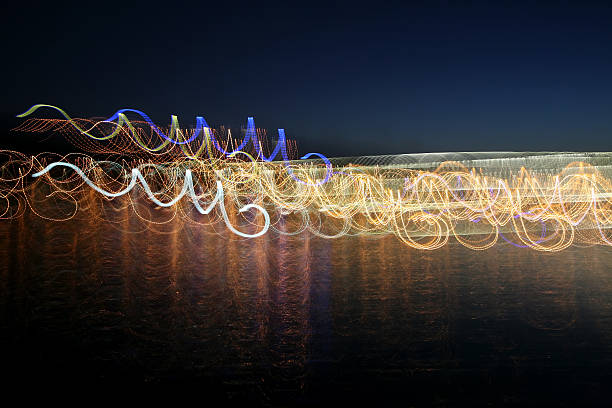istock abstract colored waves of illumination in the reflection over th 494734008