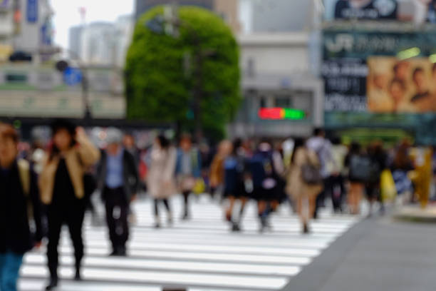 istock blurred people in bokeh. during crosswalk 494734396