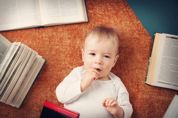 istock One year old baby with books 494734834