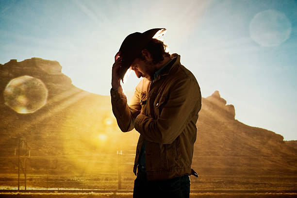 istock Cowboy standing in front of hill 494735100