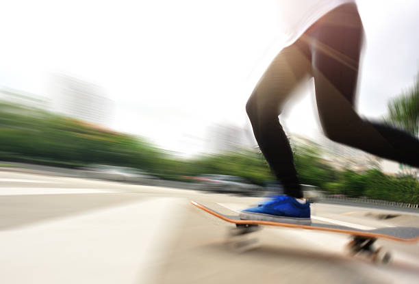 istock speeding skateboarding woman 494736751