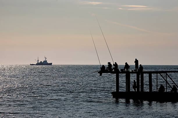 istock fishermen catch fish on the sea 494737778