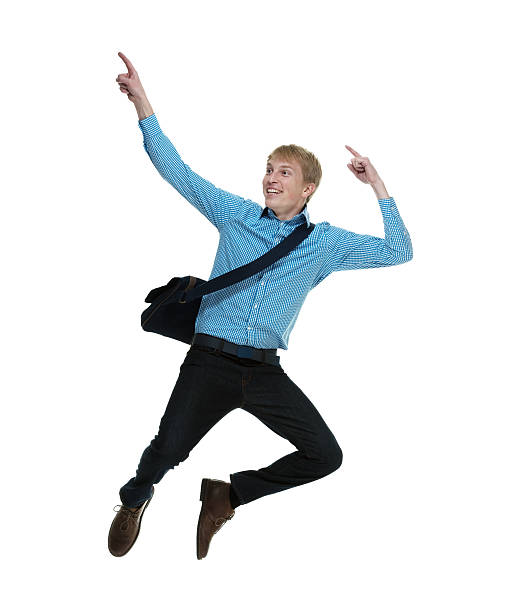 istock Happy young man jumping and pointing 494737789