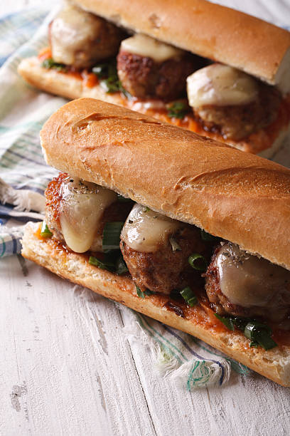 istock Hot sandwiches with meat balls closeup on the table. Vertical 494738690