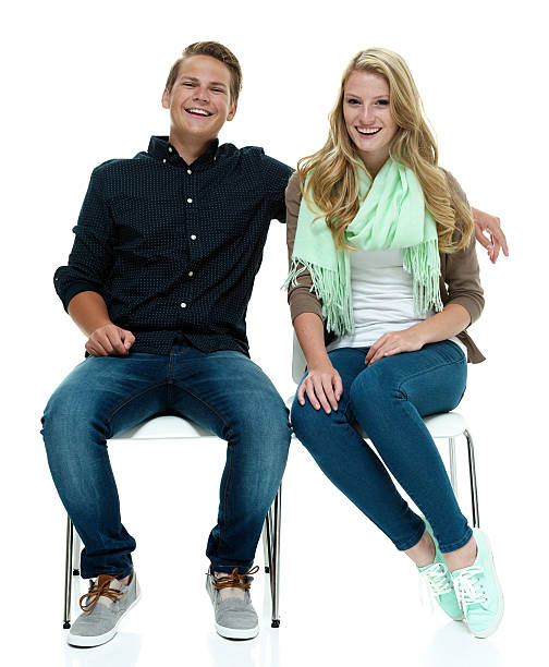 istock Smiling couple sitting and looking at camera 494739740
